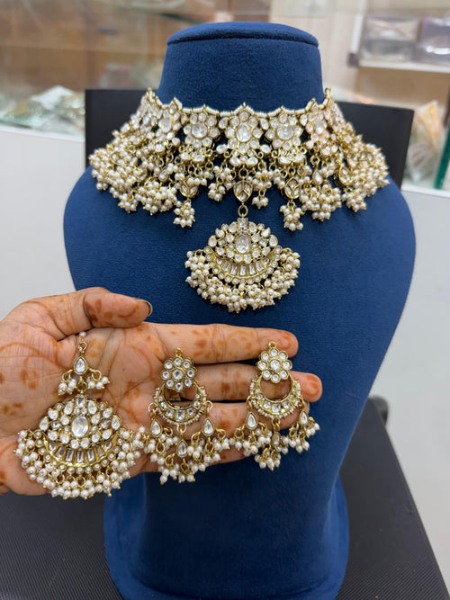 Bridal Kundan Polki jewellery set with gold choker and pearl earrings