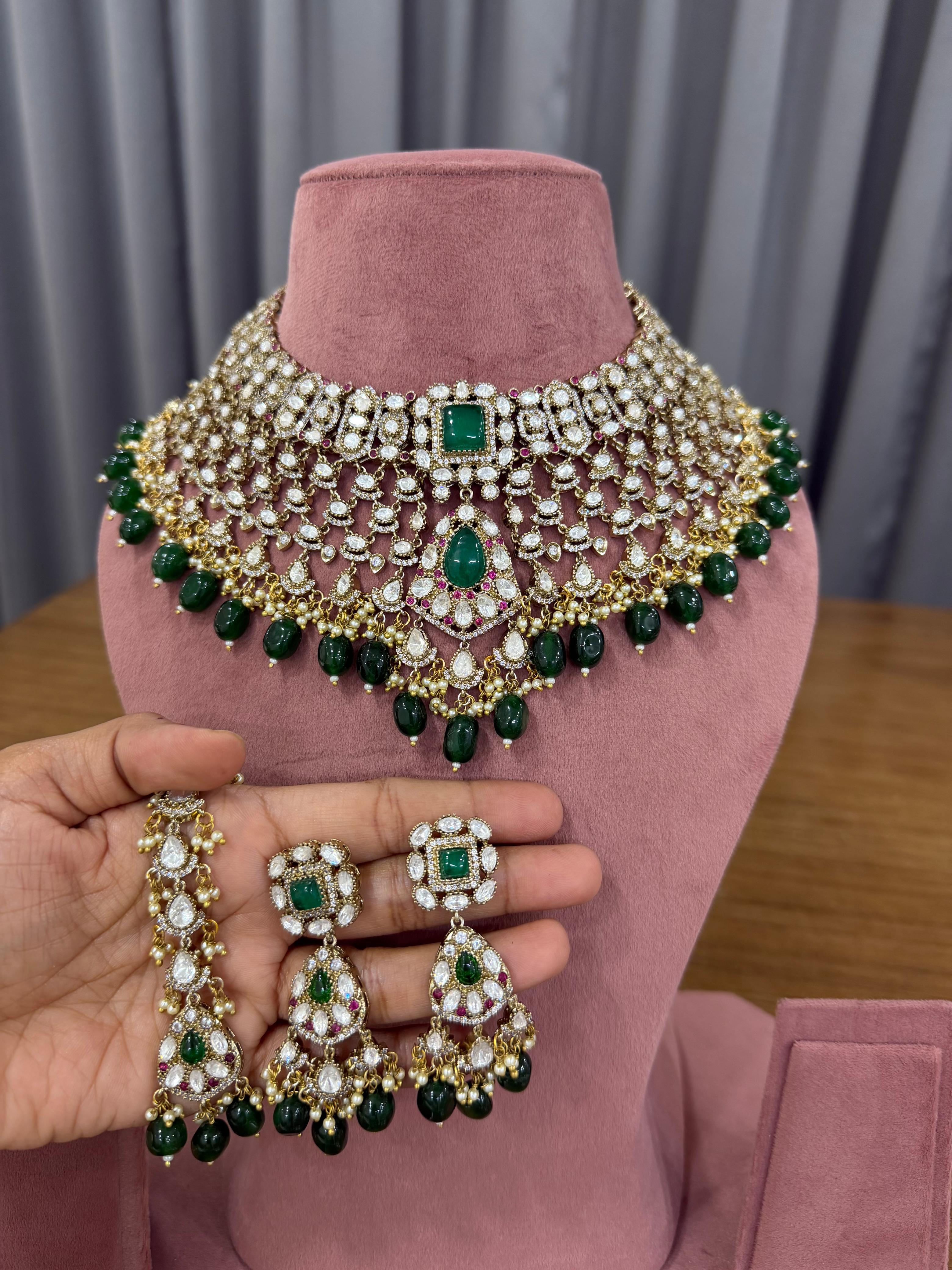 Emerald green Kundan bridal choker jewellery set with Polki stones.