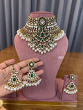 Bridal Kundan Polki jewellery set with emerald green choker necklace and earrings