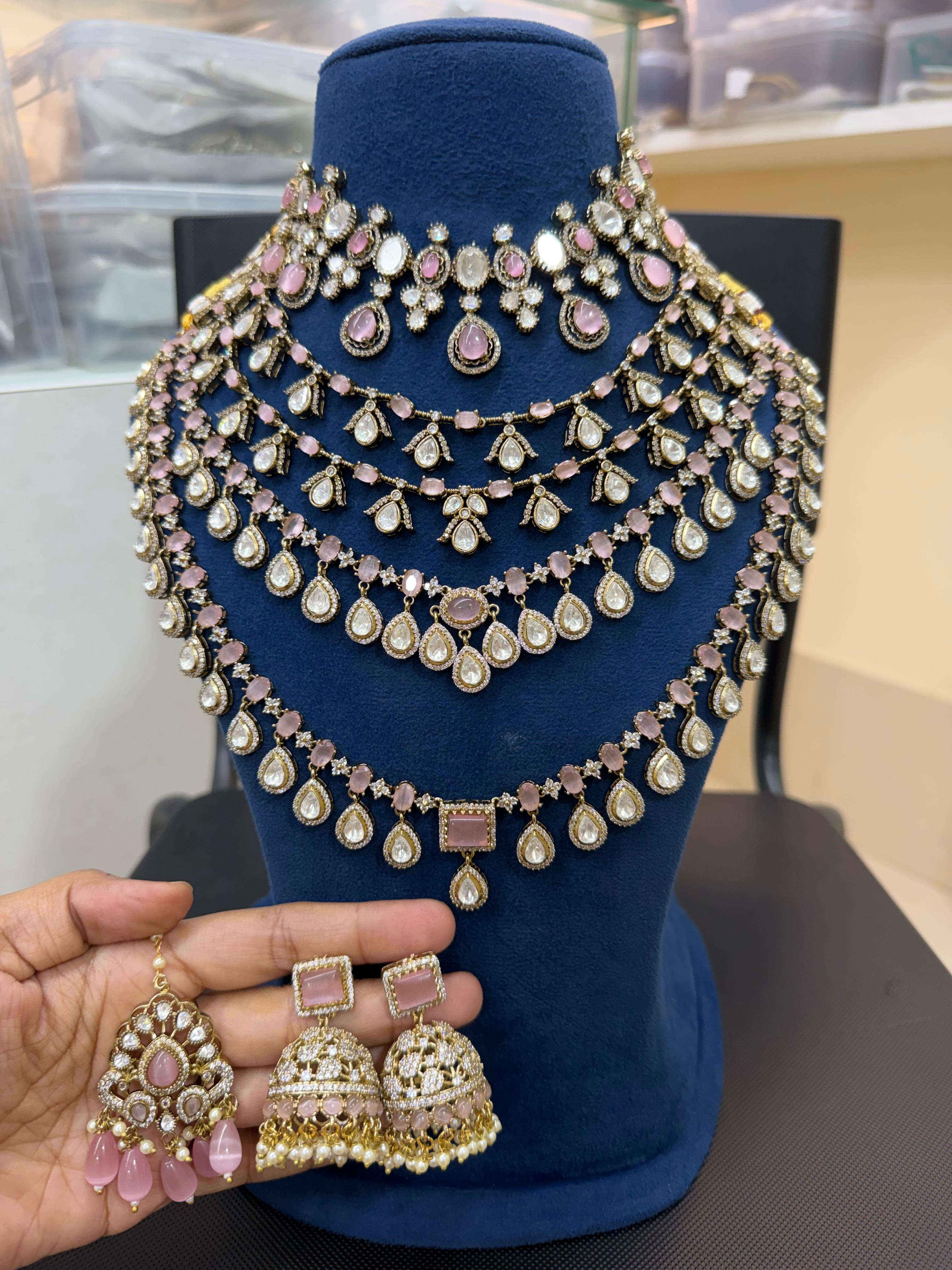 Pastel Pink Polki Bridal Jewellery Set with Layered Necklace and Jhumkas by Ganesh Kundan.