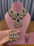 Bridal kundan polki jewellery set with green stones statement necklace and earrings