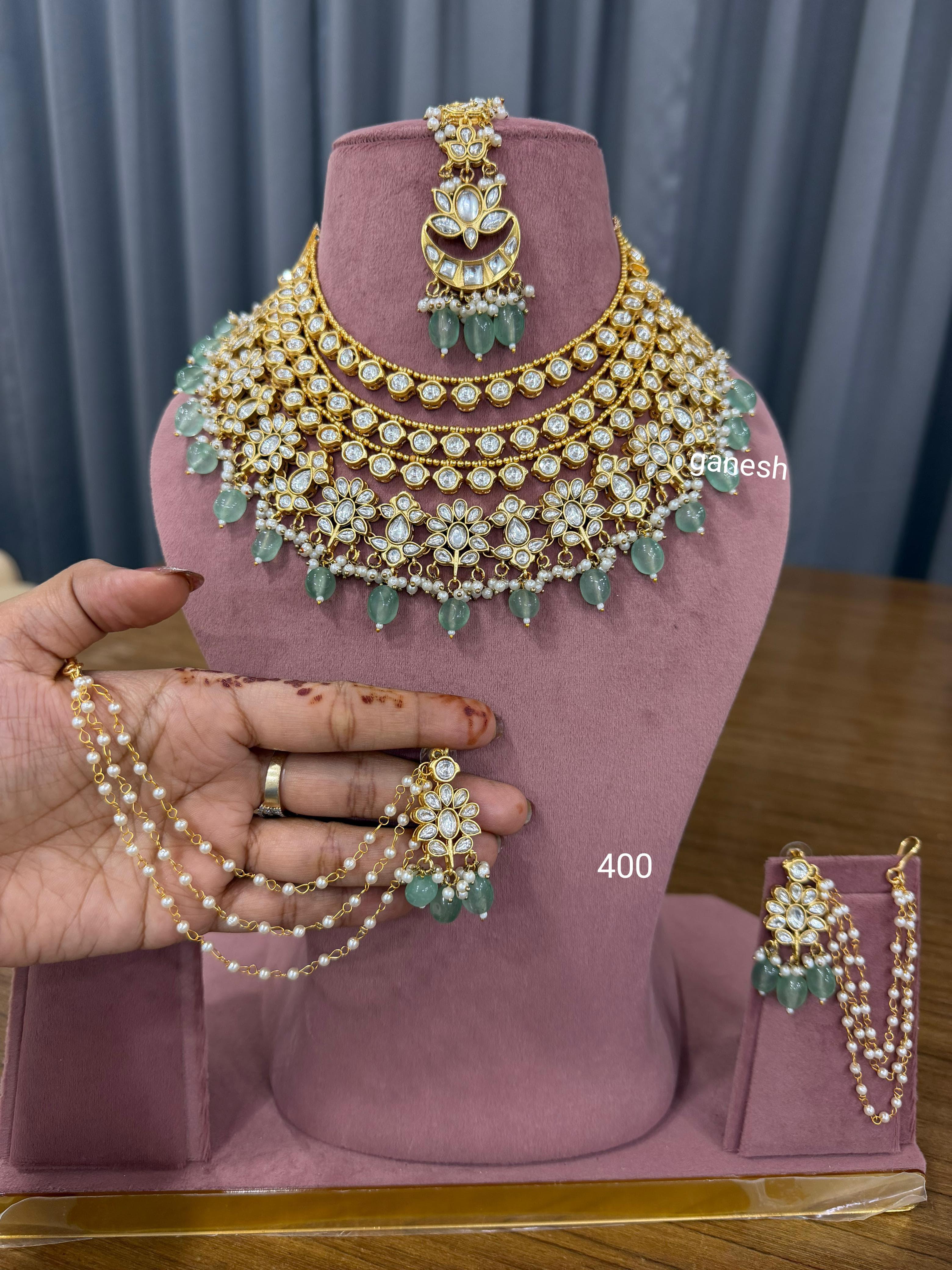 Bridal kundan polki jewellery set with green beads choker necklace earrings maang tikka