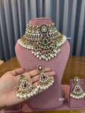Bridal kundan polki choker jewellery set with red green stones and pearl earrings