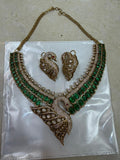 Bridal Kundan Polki jewellery set with emerald green stones choker and long necklace