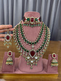 Emerald green and ruby red bridal Kundan jewellery set with choker and long necklace.