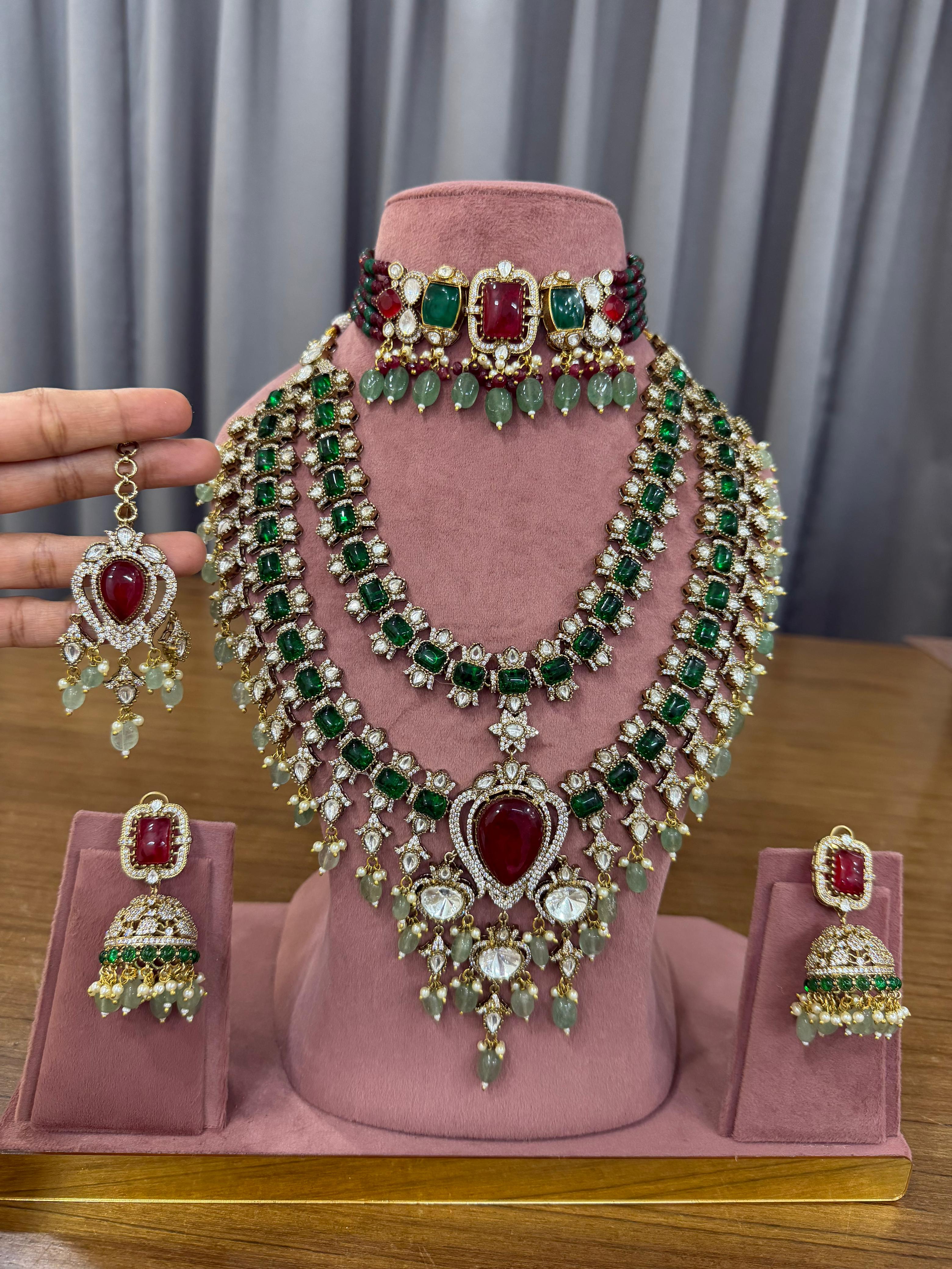 Emerald green and ruby red bridal Kundan jewellery set with choker and long necklace.