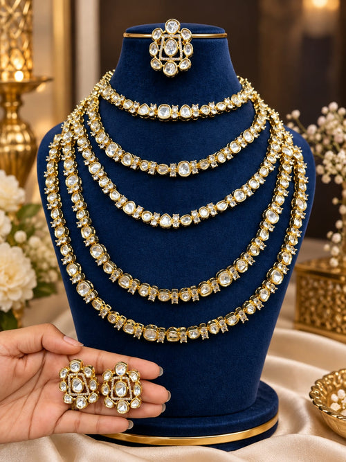 Bridal Kundan and Polki jewellery set with choker layered long necklaces earrings and maang tikka in gold